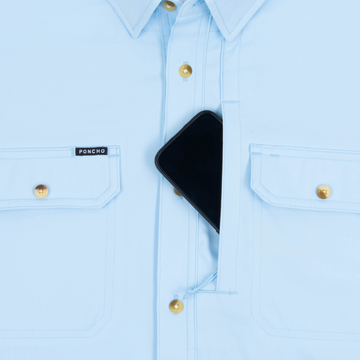 Phone in chest zipper pocket of shirt