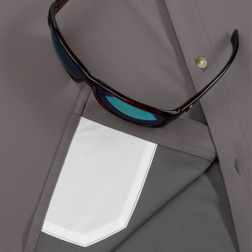 Closeup of sunglasses with lens cleaner on shirt