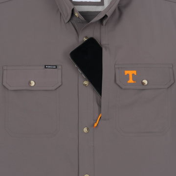 Phone in chest zipper pocket of shirt