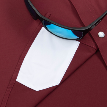 Closeup of sunglasses with lens cleaner on shirt