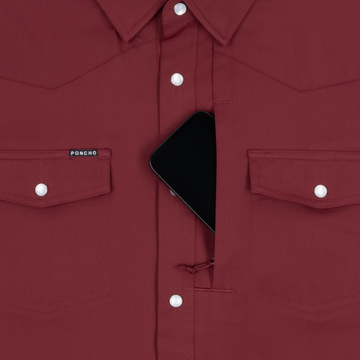 Phone in chest zipper pocket of shirt