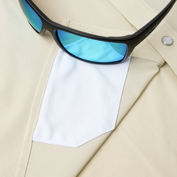 Closeup of sunglasses with lens cleaner on shirt