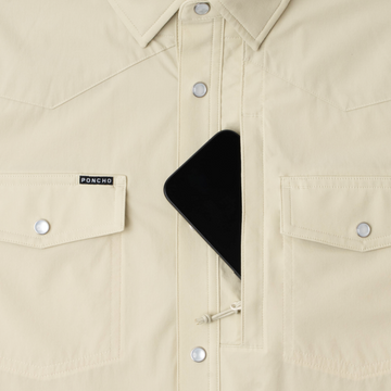 Phone in chest zipper pocket of shirt