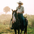 man riding a horse while wearing The Buckskin