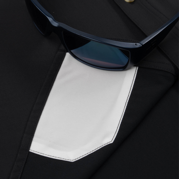 sunglasses with lens cleaner on shirt