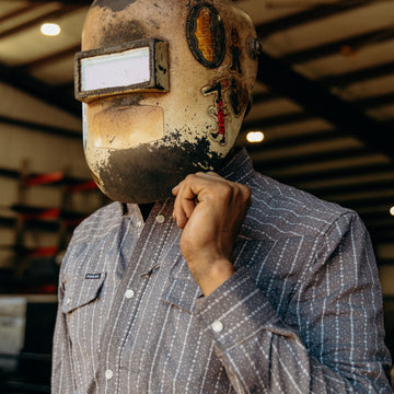man wearing a welding visor