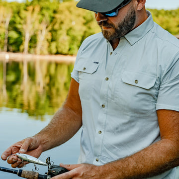 man with fishing rod wearing the carolina rig shirt