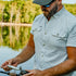 man with fishing rod wearing the carolina rig shirt