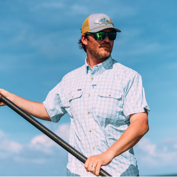 man with pole wearing the charlotte harbor shirt