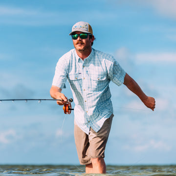 man fishing wearing the charlotte harbor shirt
