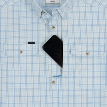 phone in chest zipper pocket of shirt