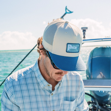 man in a boat wearing the coastal plains hat