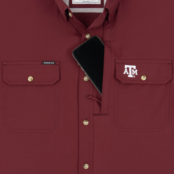 Phone in chest zipper pocket of shirt