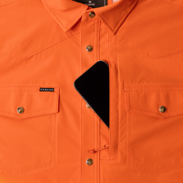 phone in chest zipper pocket of shirt