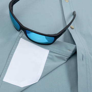 sunglasses with lens cleaner on shirt