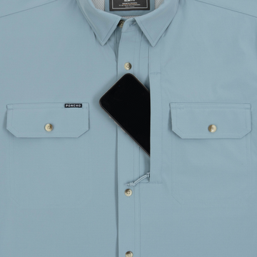 phone in chest zipper pocket of shirt