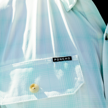 closeup of poncho logo on the drowned cays shirt