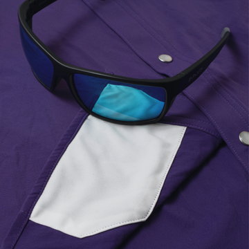 sunglasses with lens cleaner on shirt
