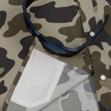 Closeup of sunglasses with lens cleaner on shirt