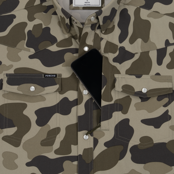 Phone in chest zipper pocket of shirt