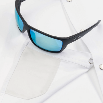 sunglasses with ens cleaner on shirt