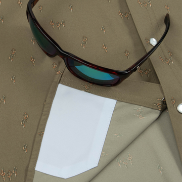Closeup of sunglasses with lens cleaner on shirt