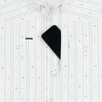 Phone in chest zipper pocket of shirt