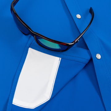 Closeup of sunglasses with lens cleaner on shirt