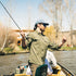 Man fishing on river wearing The Gunnison outdoors shirt