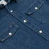 Close-up of The Harris denim shirt with pearl snap buttons and chest pockets by Poncho Outdoors