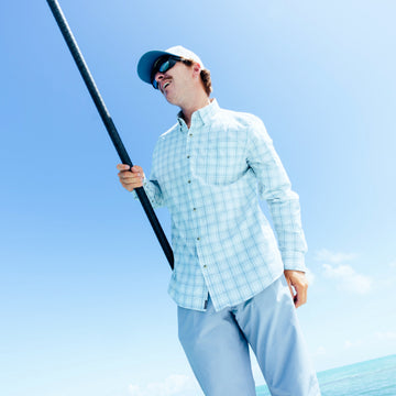man with pole wearing the head shake shirt