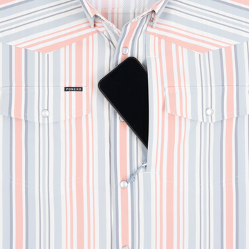 Phone in chest zipper pocket of shirt