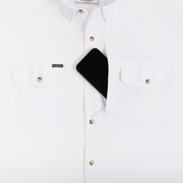 Phone in chest zipper pocket of shirt