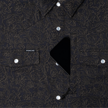 phone in chest zipper pocket of shirt