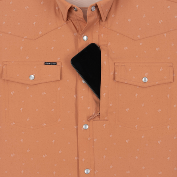 Phone in chest zipper pocket of shirt