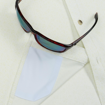 Closeup of sunglasses with lens cleaner on shirt