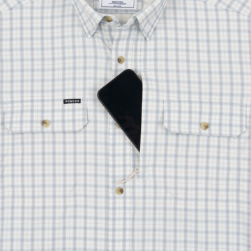 Phone in chest zipper pocket of shirt