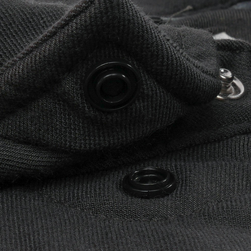 Close-up of black fabric snap buttons on The Laramie shirt