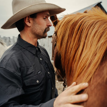 man wearing the laramie shirt with horse