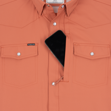 Phone in chest zipper pocket of shirt