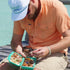 man wearing mexican sunset shirt grabbing fly