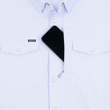Phone in chest zipper pocket of shirt