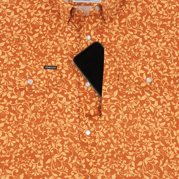 Phone in chest zipper pocket of shirt