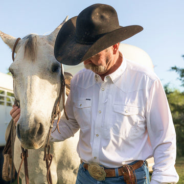 man wearing the odessa shirt with horse