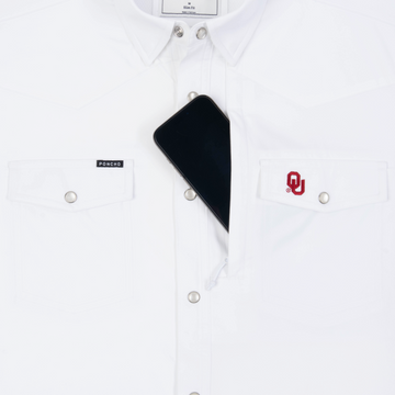 Phone in chest zipper pocket of shirt