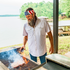 man wearing the old glory grilling steaks