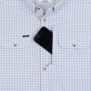 Phone in chest zipper pocket of shirt