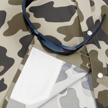 Close-up of The Pampa outdoors shirt with camouflage pattern and sunglasses on pocket