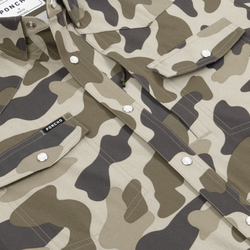 Close-up of The Pampa camo pattern shirt with snap button pockets and collar detail