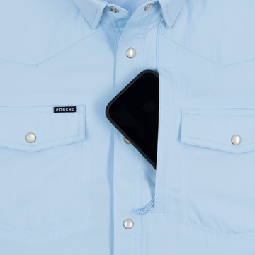Phone in chest zipper pocket of shirt